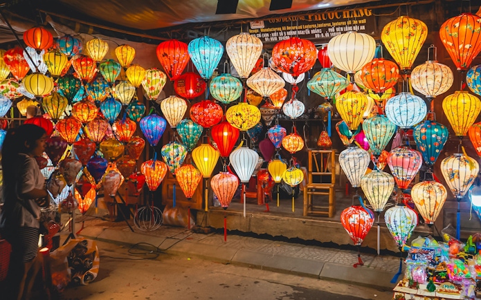 Hoi An night market with colorful traditional lanterns on display.