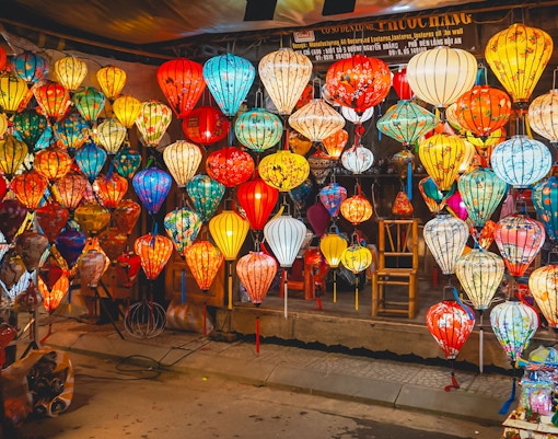 Hoi An night market with colorful traditional lanterns on display.