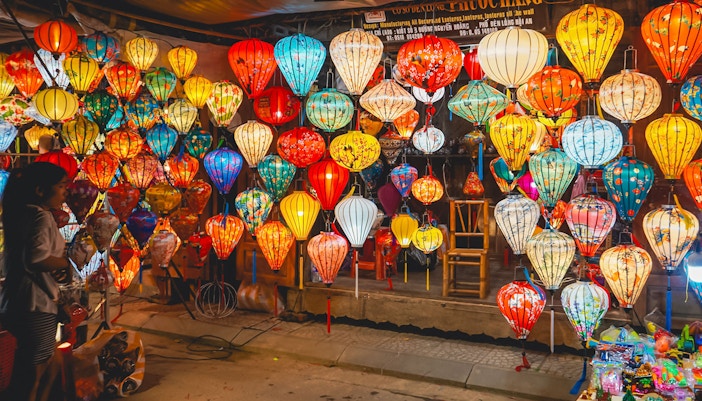Hoi An night market with colorful traditional lanterns on display.