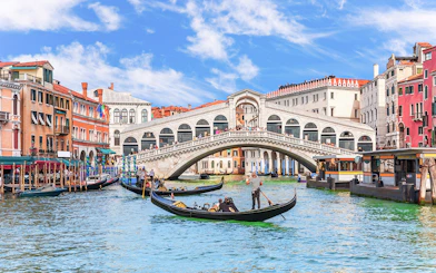 Gondolas on the Grand Canal near the Rialto Bridge in Venice.