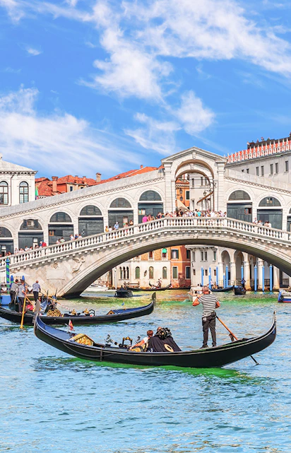 Gondolas on the Grand Canal near the Rialto Bridge in Venice.