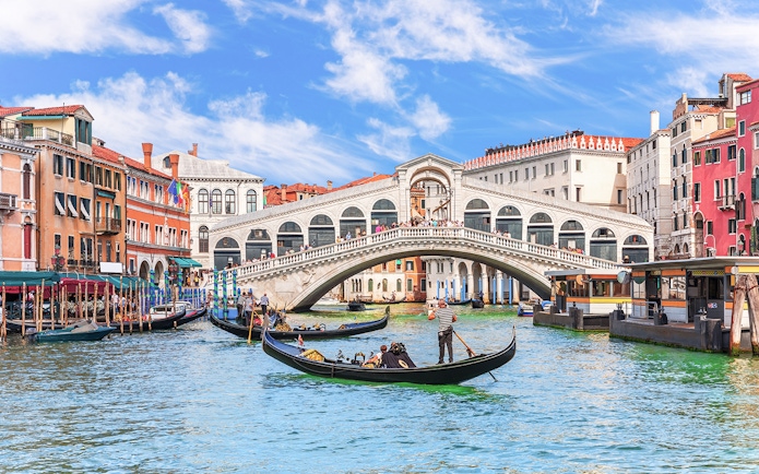 Gondolas on the Grand Canal near the Rialto Bridge in Venice.