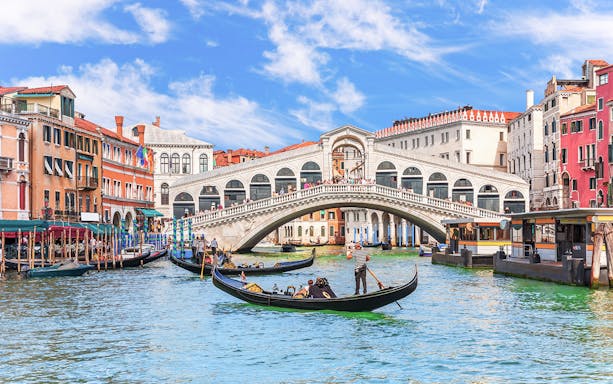 Gondolas on the Grand Canal near the Rialto Bridge in Venice.