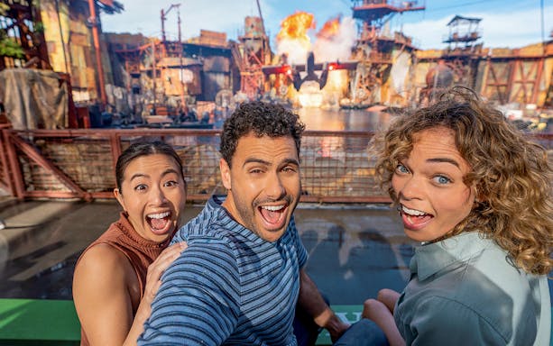 Visitors enjoying a live action show with explosions at Universal Studios Hollywood.