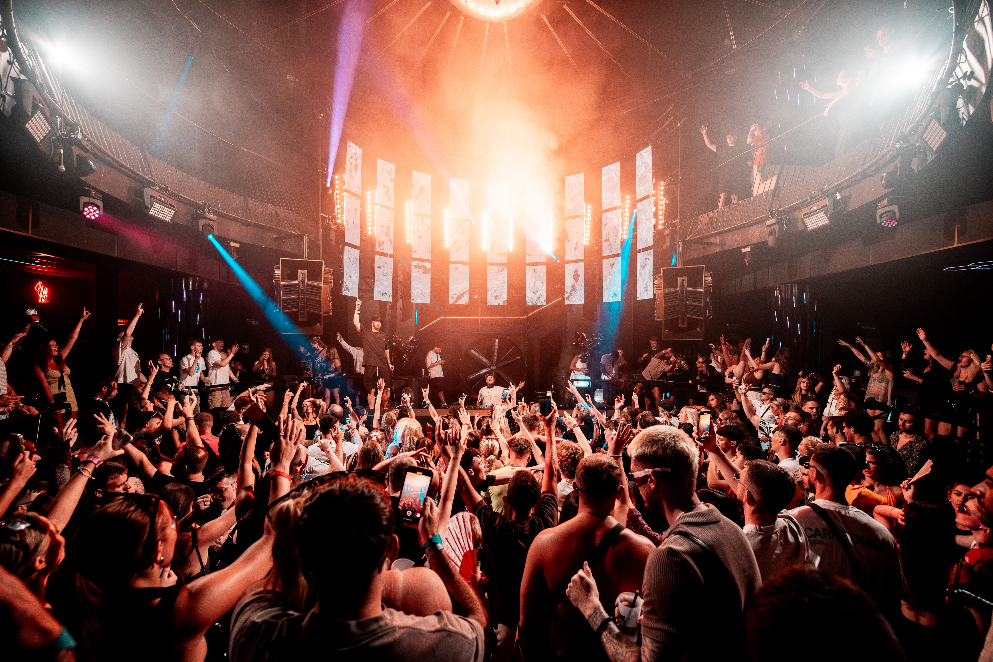 Dance floor at Eden Ibiza during One More Time event, showcasing vibrant lights and energetic crowd.