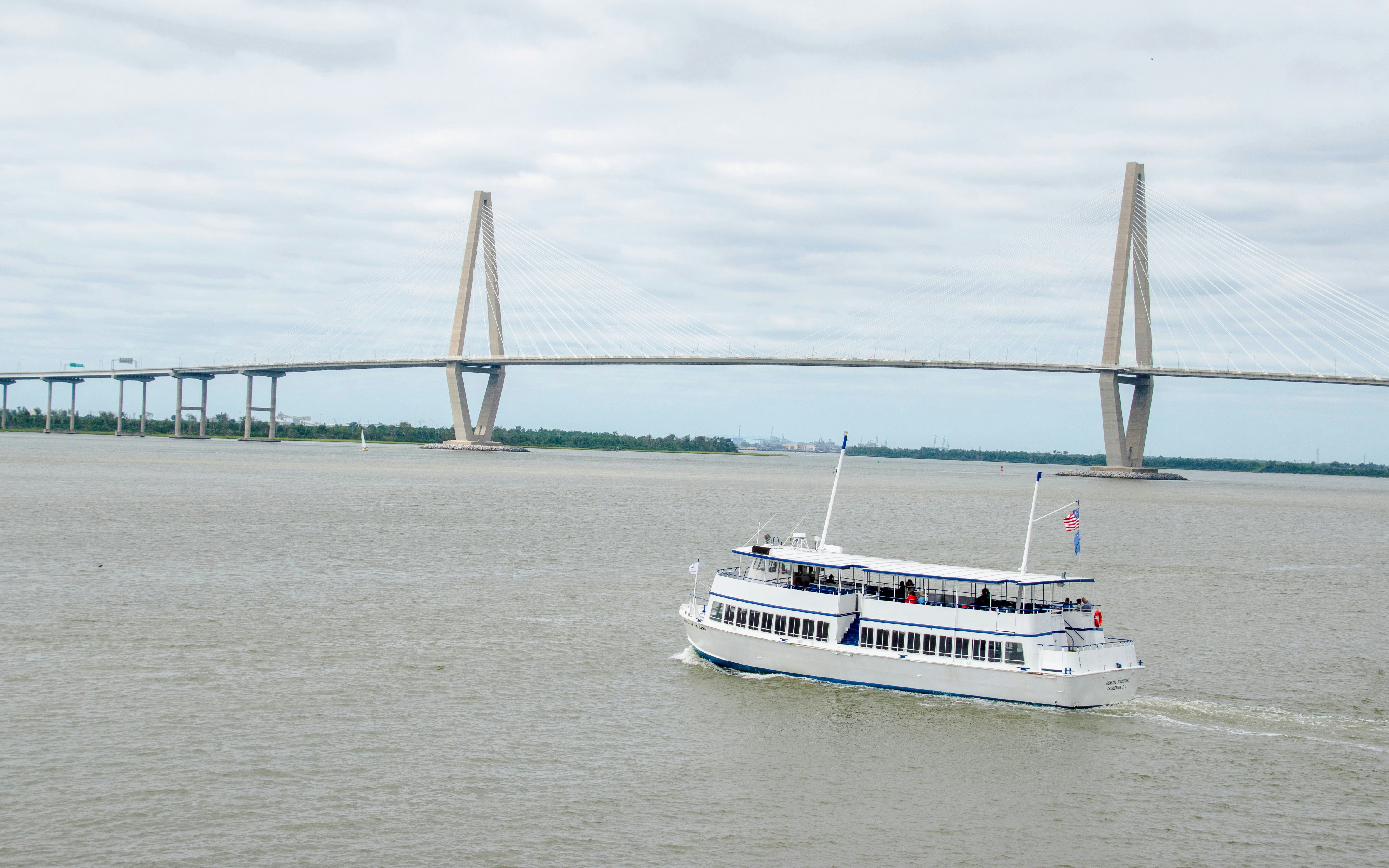 Tour boat on Cooper River with Arthur Ravenel Jr. Bridge, Charleston.