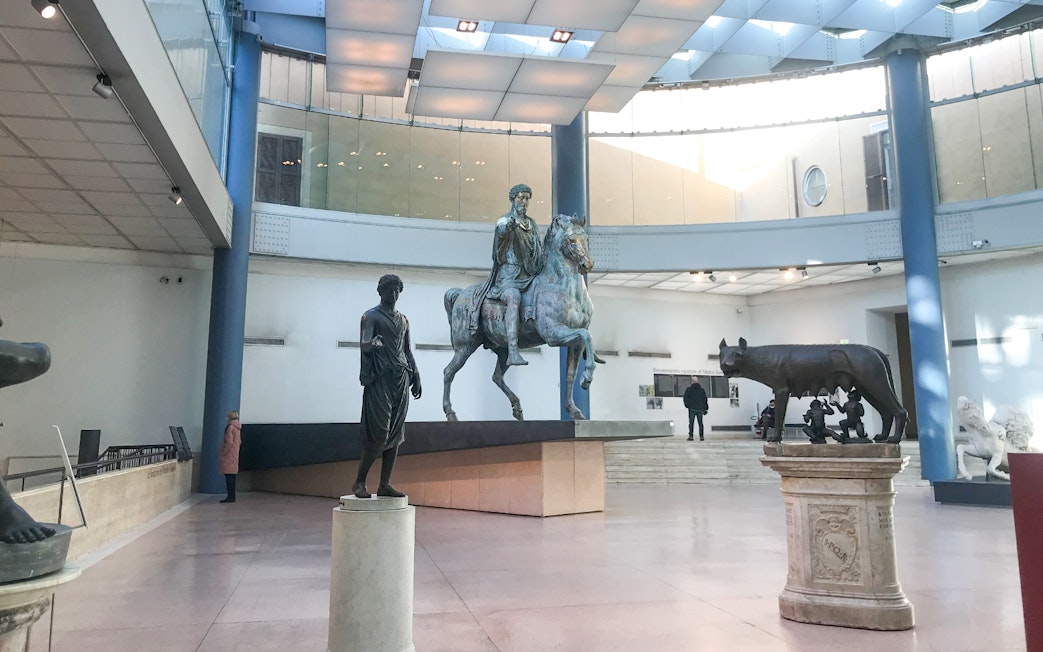 Capitoline Museums statues including Marcus Aurelius on horseback and the Capitoline Wolf in Rome.