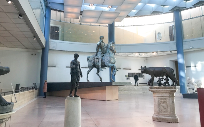 Capitoline Museums statues including Marcus Aurelius on horseback and the Capitoline Wolf in Rome.
