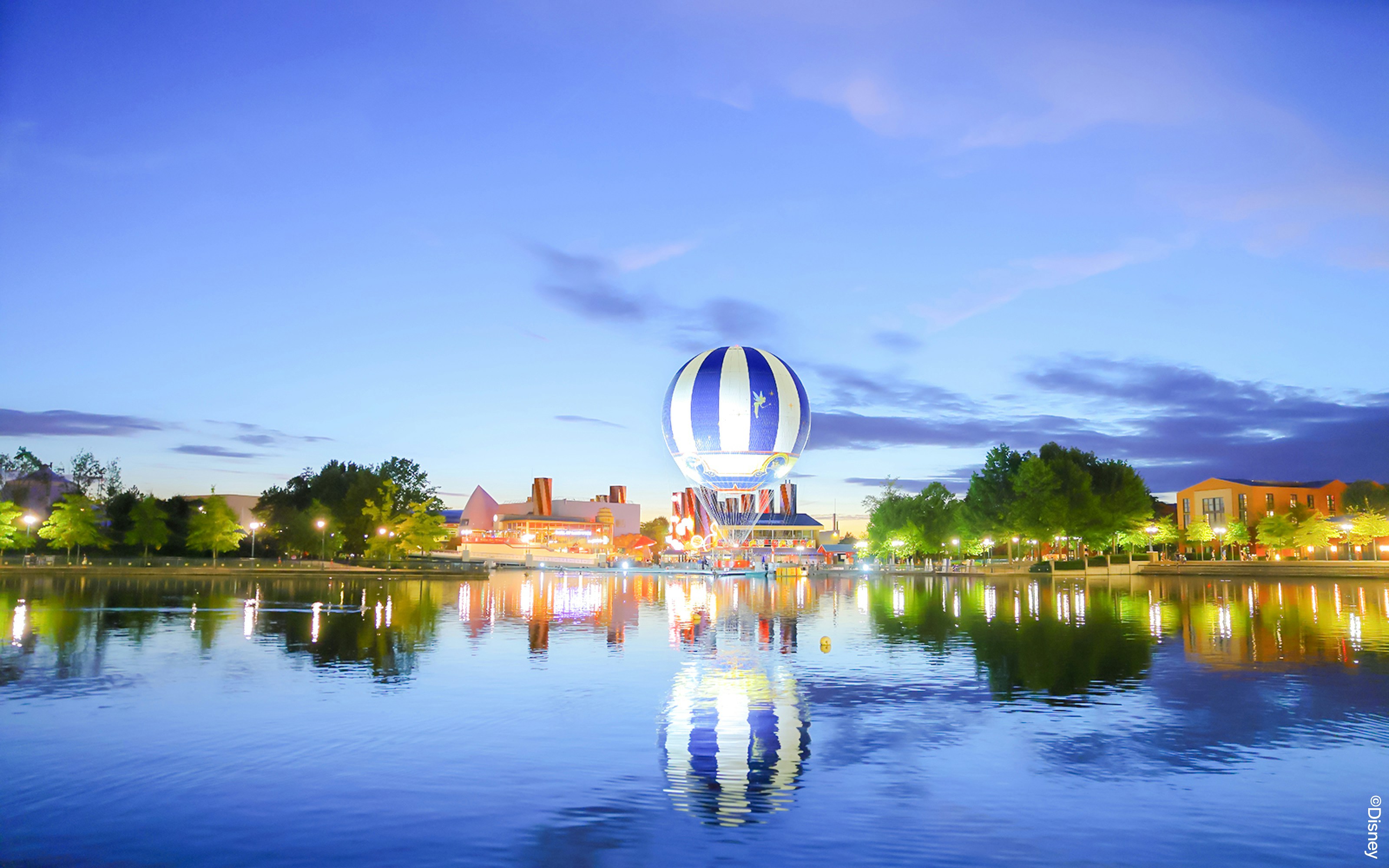 Balloon PanoraMagique over lake at Disneyland Paris, France during twilight.