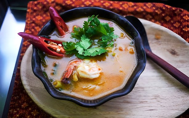 Tom yum soup with shrimp and herbs at Silom Thai Cooking School.