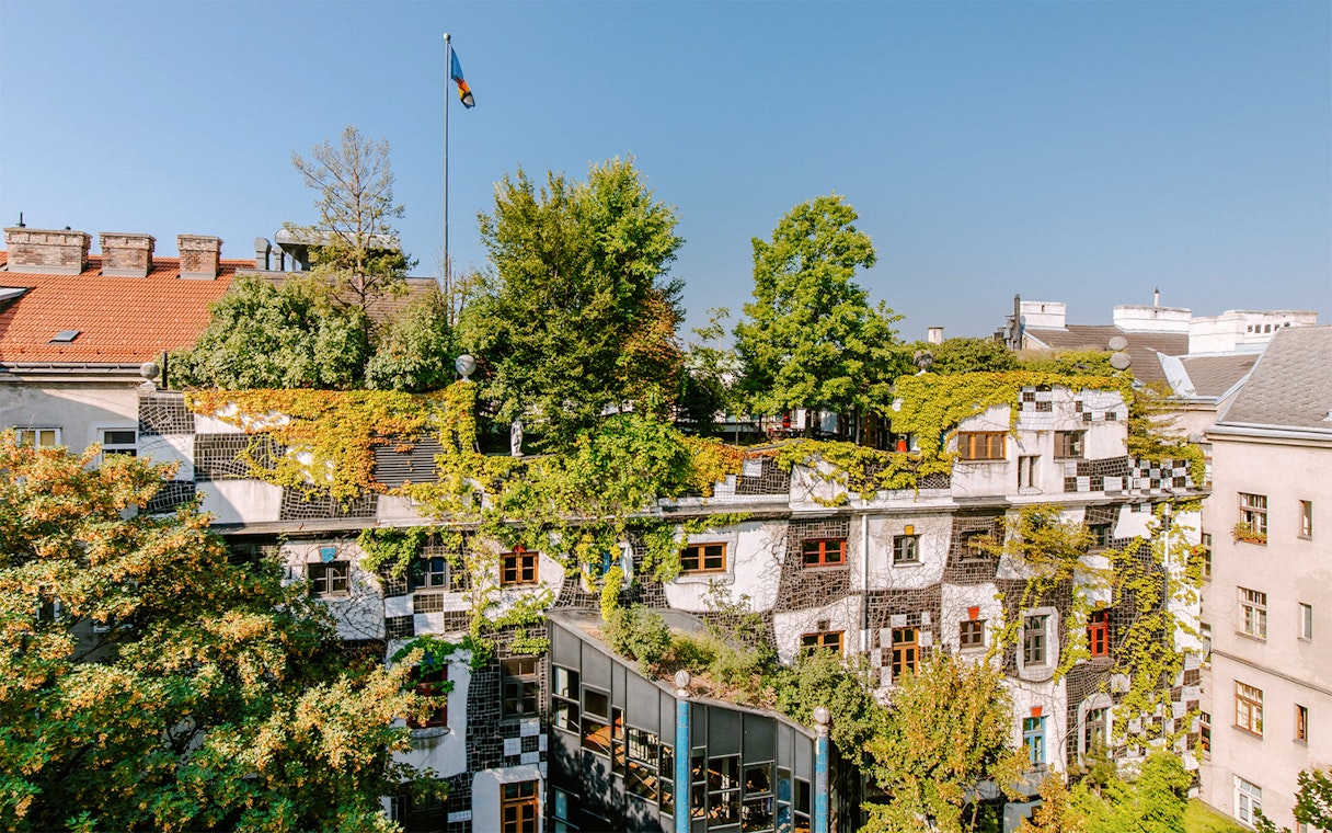 KUNST HAUS WIEN rooftop garden with lush greenery and colorful windows in Vienna.