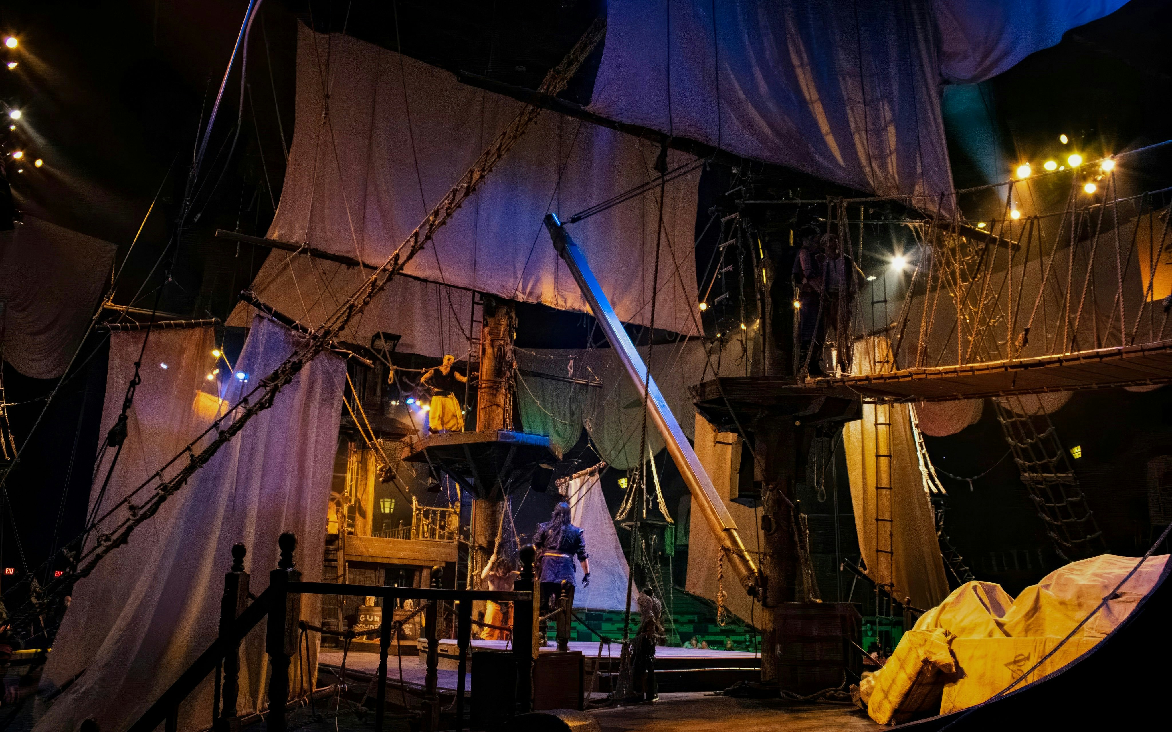 Pirate-themed stage with actors performing at Pirates Dinner Adventure Show.