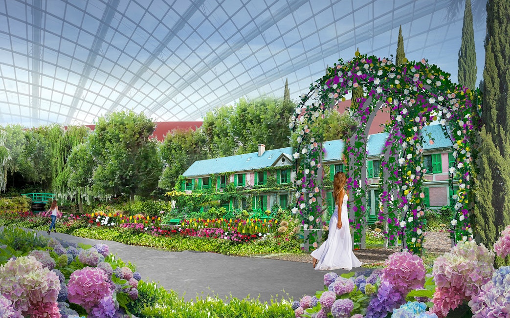 Monet-inspired garden with floral arch and house at Gardens by the Bay exhibition.