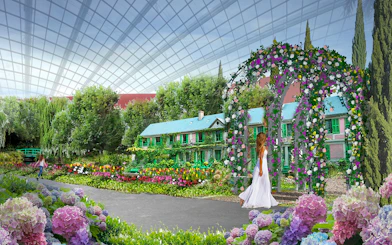 Monet-inspired garden with floral arch and house at Gardens by the Bay exhibition.