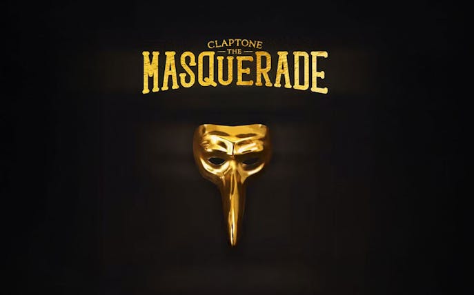 Claptone's golden mask with "The Masquerade" text for Club Chinois event.