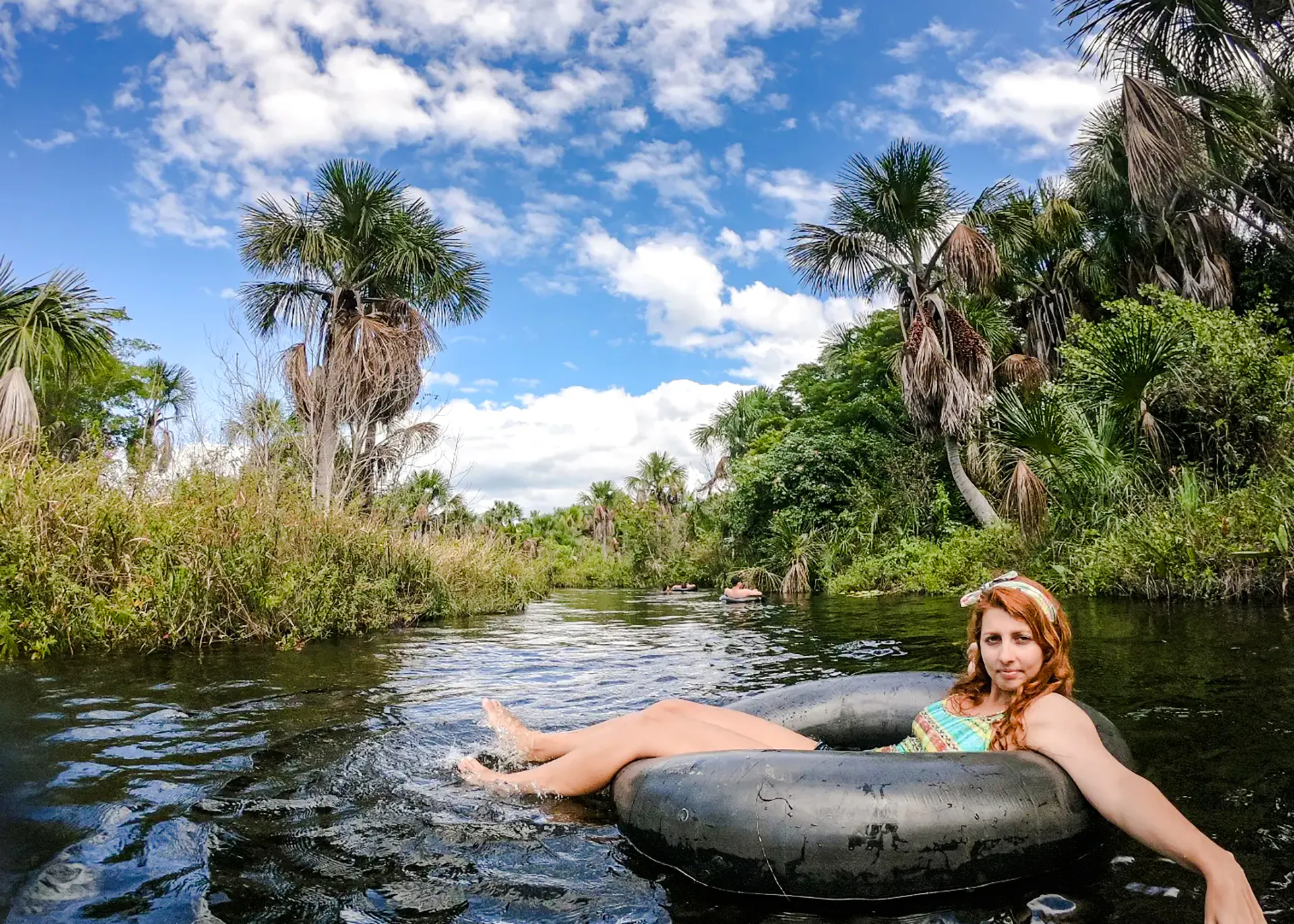 Tubing in Cardosa river surrounded by lush greenery, Barreirinhas, Sao Paulo.