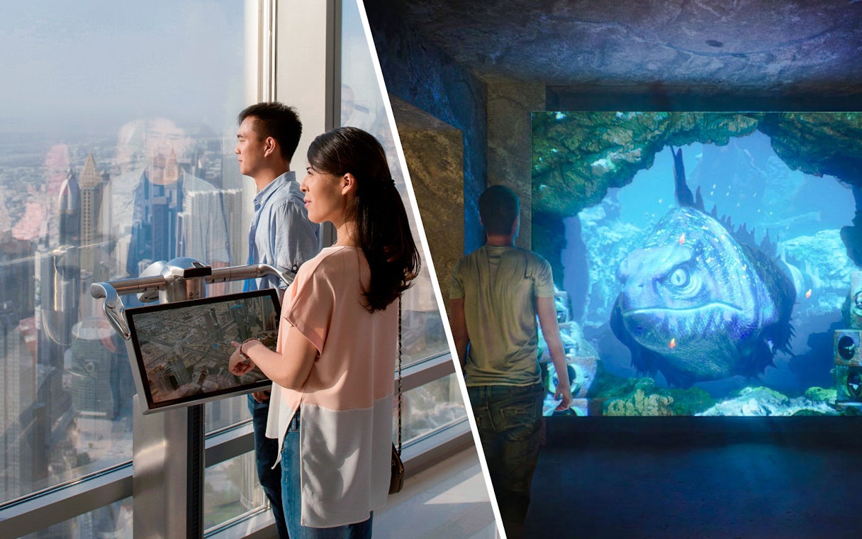 Visitors exploring The Lost World Aquarium with a large prehistoric fish display.