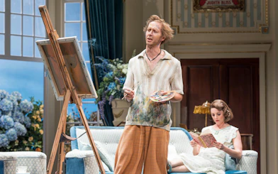 Actor painting on stage during HAY FEVER performance, Westend.