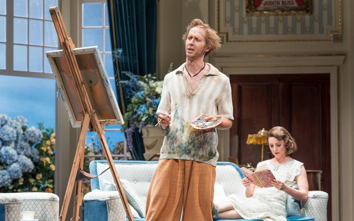 Actor painting on stage during HAY FEVER performance, Westend.