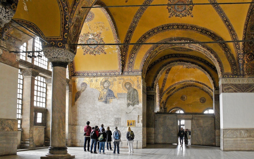 Visitors viewing Deesis mosaic in Hagia Sophia, Istanbul, Turkey.
