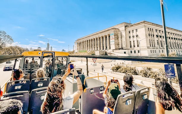 Open-top bus tour passing by the University of Buenos Aires Law School.