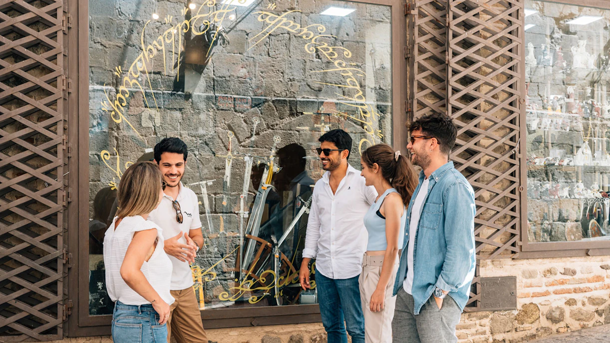 Tourist group with guide outside a sword shop in Toledo.