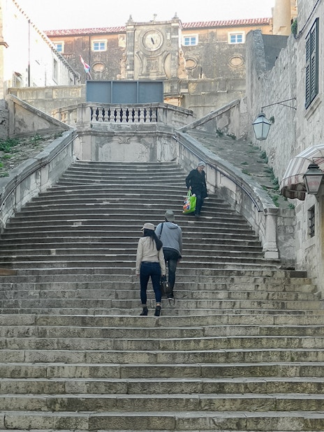 People walking up the Jesuit Staircase in Dubrovnik, featured in King's Landing Walking Tour.