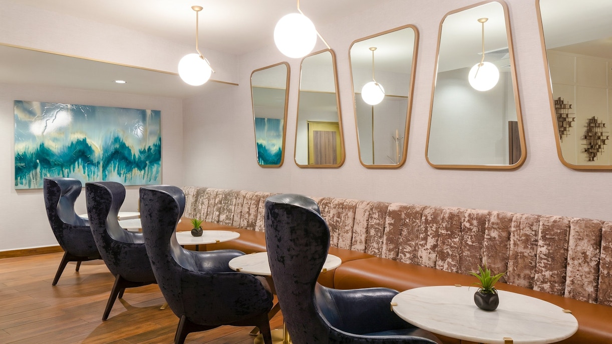Lounge seating area at MERA Business Lounge, Cancun International Airport.