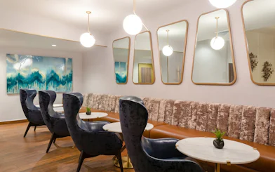 Lounge seating area at MERA Business Lounge, Cancun International Airport.