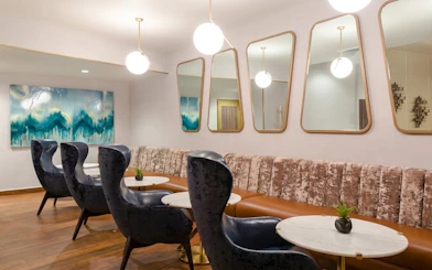 Lounge seating area at MERA Business Lounge, Cancun International Airport.