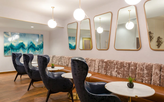 Lounge seating area at MERA Business Lounge, Cancun International Airport.