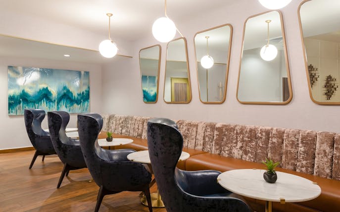 Lounge seating area at MERA Business Lounge, Cancun International Airport.
