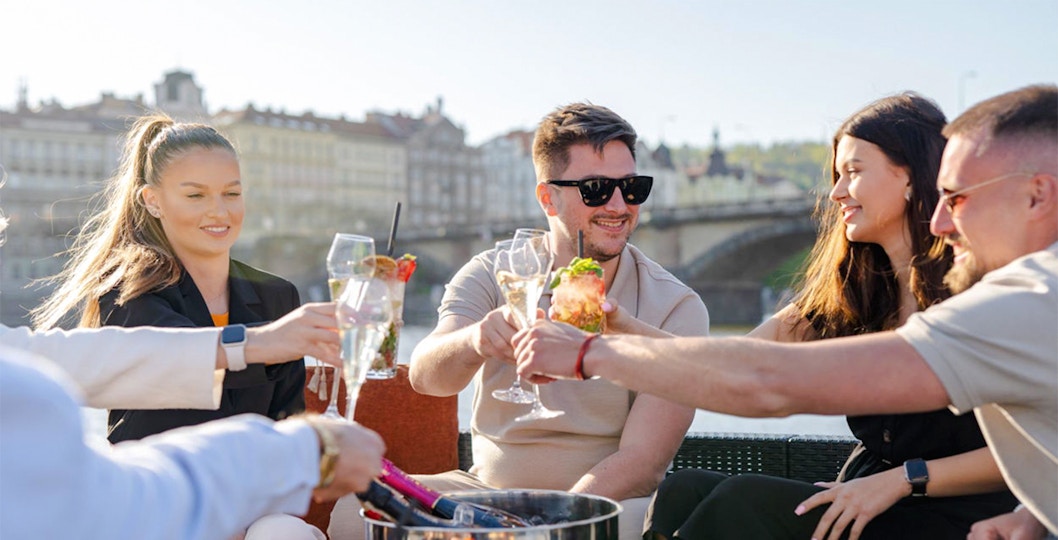 Tourists enjoying beer on beer boat in Prague