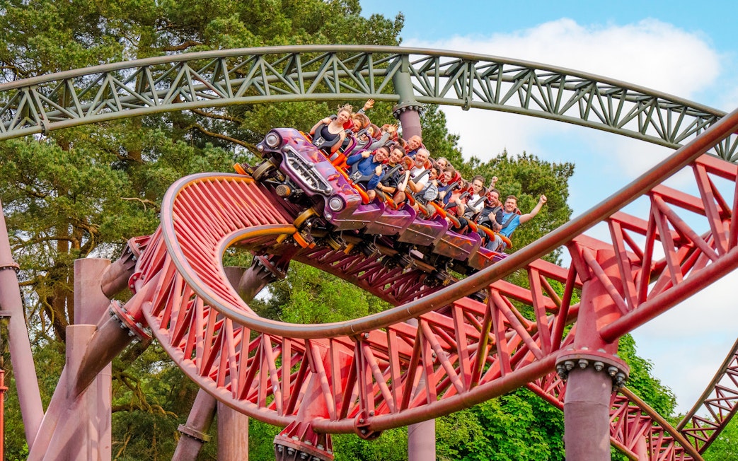 Guests riding the Rita rollercoaster at Alton Towers, UK.