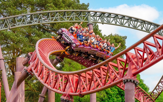 Guests riding the Rita rollercoaster at Alton Towers, UK.