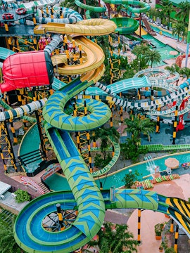 Water slides and attractions at a theme park in Pattaya, Thailand.