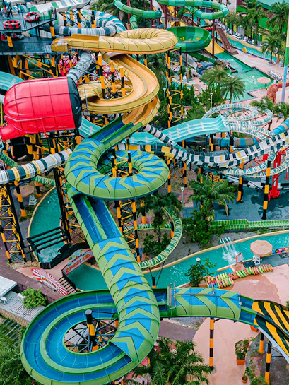 Water slides and attractions at a theme park in Pattaya, Thailand.