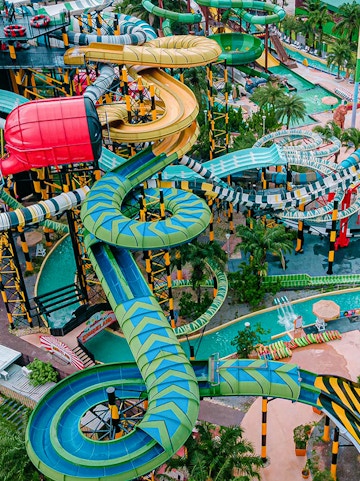 Water slides and attractions at a theme park in Pattaya, Thailand.