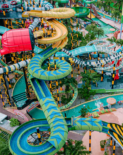 Water slides and attractions at a theme park in Pattaya, Thailand.