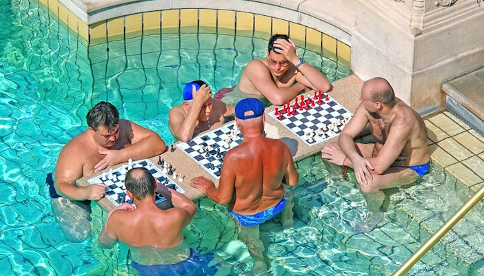 Guests relaxing in the thermal pool at Szechenyi Baths, Budapest.