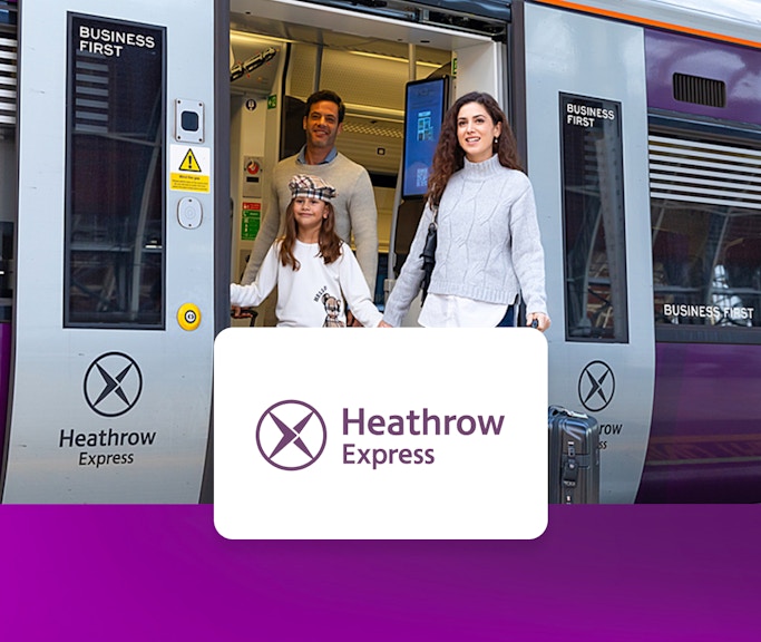 Passengers exiting Heathrow Express train at London Paddington station.