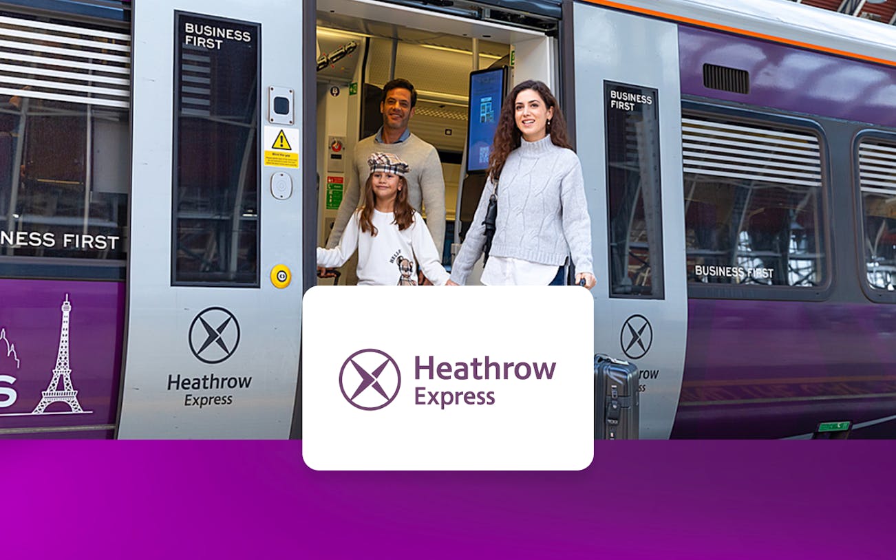 Passengers exiting Heathrow Express train at London Paddington station.