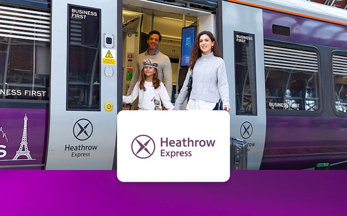 Passengers exiting Heathrow Express train at London Paddington station.