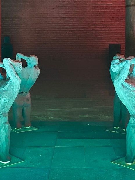 Sculptures inside Basilica Cistern, Istanbul, with illuminated columns.