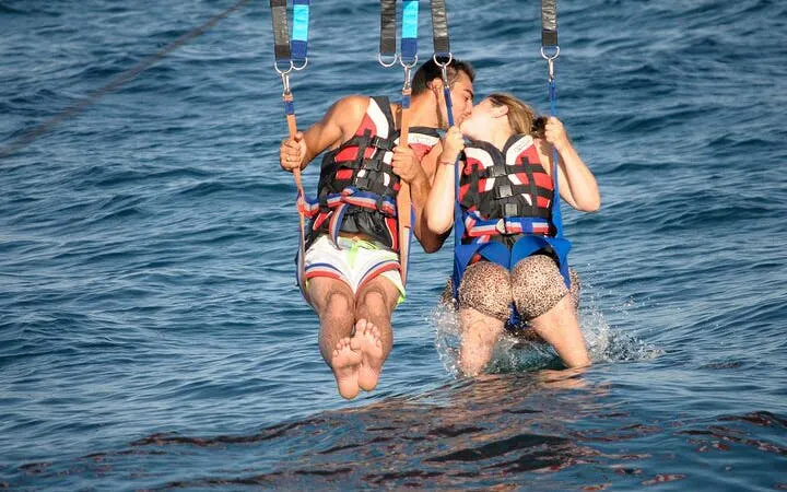 Parasailing couple over the Red Sea, Hurghada adventure.