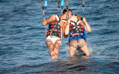 Parasailing couple over the Red Sea, Hurghada adventure.