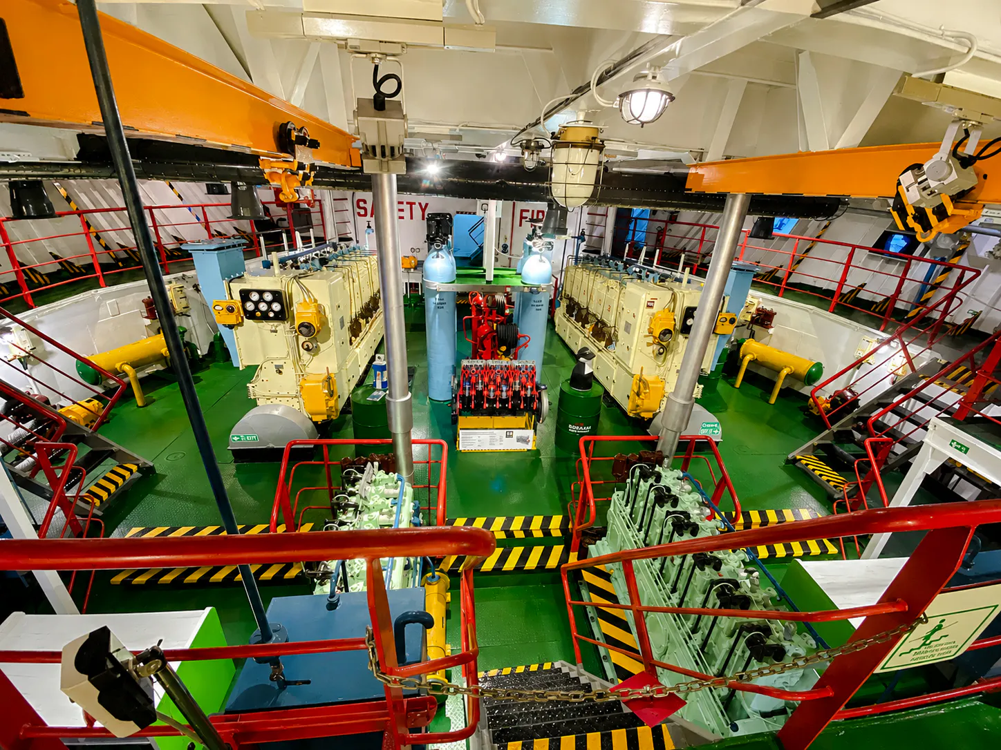 Engine room of the world's first tanker museum in Baku, featuring machinery and safety equipment.