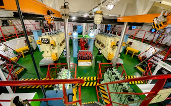 Engine room of the world's first tanker museum in Baku, featuring machinery and safety equipment.