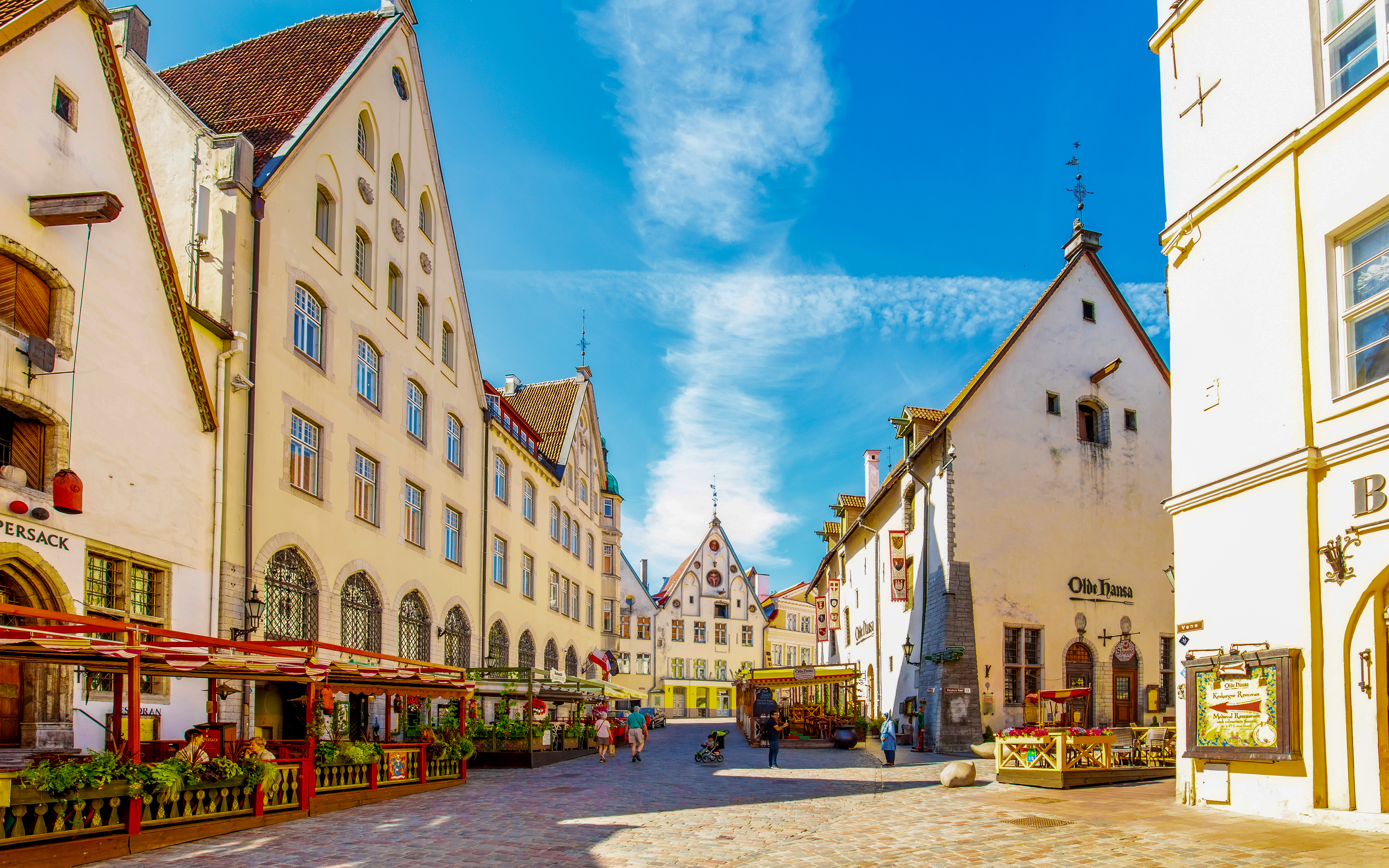 Tallinn old town square with medieval buildings and outdoor cafes, Estonia.