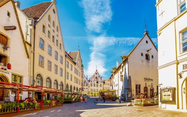Tallinn old town square with medieval buildings and outdoor cafes, Estonia.